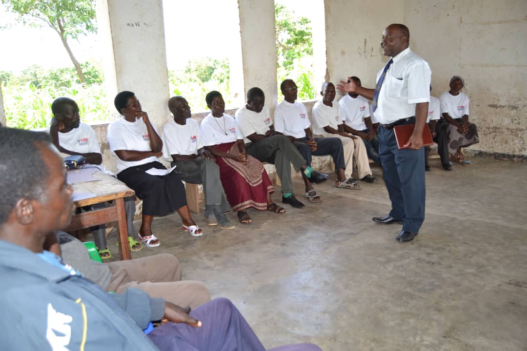 Picture of Karonga District Commissioner instructing CBEs on Gender Based Violence